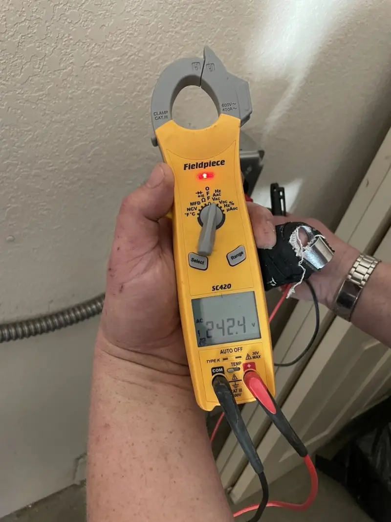 Voltage testing with clamp meter during Recessed Lighting Installation in Spring Valley
